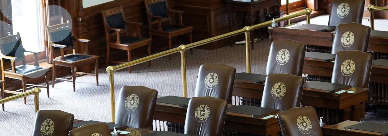 Overhead shot of empty seats in the Harris County legislative chamber